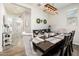 Cozy dining room with a dark wood table, seating for eight, and plenty of natural light at 1151 S Avoca --, Mesa, AZ 85208