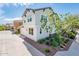 Angle shot of the exterior highlighting a garage and beautiful curb appeal with tasteful landscaping and modern architecture at 1151 S Avoca --, Mesa, AZ 85208