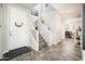 Bright foyer features a staircase, modern tile flooring, white walls, and accents creating a welcoming atmosphere at 1151 S Avoca --, Mesa, AZ 85208