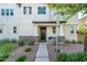 Inviting front entrance with well-manicured landscaping, decorative wreath, bench, and stylish architectural details at 1151 S Avoca --, Mesa, AZ 85208