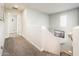 Upstairs hallway with carpet flooring, and views of open doorway and framed artwork at 1151 S Avoca --, Mesa, AZ 85208