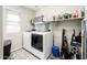 Convenient laundry room equipped with washer, dryer, and shelving at 1151 S Avoca --, Mesa, AZ 85208