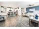 Open layout featuring the kitchen and living room, with an island, tile floors, and modern decor at 1151 S Avoca --, Mesa, AZ 85208