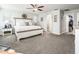 Spacious main bedroom features plush carpeting, ceiling fan, and ensuite bathroom access at 1151 S Avoca --, Mesa, AZ 85208