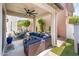 A covered patio features ample seating and ceiling fan, perfect for outdoor entertaining at 1151 S Avoca --, Mesa, AZ 85208