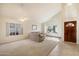 Bright living room with lots of natural light and neutral carpeting and tile flooring at 11805 N 90Th Way, Scottsdale, AZ 85260