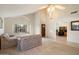 Large carpeted living room with high ceilings, natural lighting and views to the kitchen and entry at 11805 N 90Th Way, Scottsdale, AZ 85260