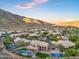 Desert community aerial shot featuring a beautiful home with pool, and sports court at 14049 S 8Th St, Phoenix, AZ 85048