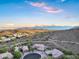 Expansive aerial shot highlights mountain views, residential neighborhood, and a desert landscape at 14049 S 8Th St, Phoenix, AZ 85048