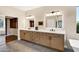 Modern bathroom featuring a dual sink vanity with custom cabinetry and sleek design at 14049 S 8Th St, Phoenix, AZ 85048