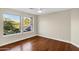 Bedroom with wood floors and a view of the surrounding landscape at 14049 S 8Th St, Phoenix, AZ 85048