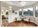 Sitting area in main bedroom with natural light, two chairs and view of bathroom at 14049 S 8Th St, Phoenix, AZ 85048