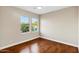 Bedroom with wood floors and a view of the surrounding landscape at 14049 S 8Th St, Phoenix, AZ 85048