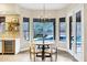 Bright dining area that has views of the backyard pool and surrounding landscape at 14049 S 8Th St, Phoenix, AZ 85048