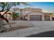 Stunning two-story residence with a three-car garage, desert landscaping, and a tile roof at 14049 S 8Th St, Phoenix, AZ 85048