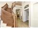 Open foyer featuring hardwood floors, a curved staircase, and a view of the second floor at 14049 S 8Th St, Phoenix, AZ 85048