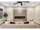 Bright living room with a fireplace, modern furnishings, and plenty of natural light at 14049 S 8Th St, Phoenix, AZ 85048