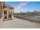 Expansive outdoor patio featuring concrete flooring, stucco walls and railing, and double doors leading indoors at 14049 S 8Th St, Phoenix, AZ 85048