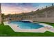 Outdoor swimming pool with diving board, barbecue area and desert view at 14049 S 8Th St, Phoenix, AZ 85048