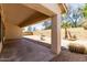 Relaxing covered back patio overlooking a beautifully landscaped backyard with decorative fountain at 14470 N 98Th Pl, Scottsdale, AZ 85260