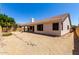Spacious backyard with desert landscaping, featuring a covered patio perfect for entertaining at 14470 N 98Th Pl, Scottsdale, AZ 85260