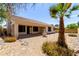 Desert landscaped backyard with mature palm tree, patio and fountain feature at 14470 N 98Th Pl, Scottsdale, AZ 85260