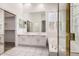 Elegant bathroom with double sinks, a large mirror, and a separate tub at 14470 N 98Th Pl, Scottsdale, AZ 85260
