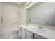 Bright bathroom featuring a double vanity, large mirror, and accessible shower-tub combination at 14470 N 98Th Pl, Scottsdale, AZ 85260
