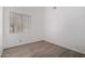 Comfortable bedroom with contemporary wood-look flooring and a window with blinds at 14470 N 98Th Pl, Scottsdale, AZ 85260