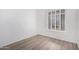 Bright bedroom with contemporary shuttered windows and modern wood-look flooring at 14470 N 98Th Pl, Scottsdale, AZ 85260