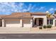 Attractive home with a well-maintained yard, three-car garage, and tile roof at 14470 N 98Th Pl, Scottsdale, AZ 85260