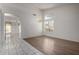 Open-concept living space with hardwood floors, chandelier and lots of natural light at 14470 N 98Th Pl, Scottsdale, AZ 85260