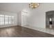 Inviting Living Room with chandelier, wood floors and ample natural light at 14470 N 98Th Pl, Scottsdale, AZ 85260