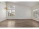 Spacious living room with high ceilings, chandelier and plantation shutters at 14470 N 98Th Pl, Scottsdale, AZ 85260