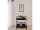 Stylishly decorated bar cart featuring elegant glassware, decorative accents, and a sleek design at 16409 N 65Th Pl, Scottsdale, AZ 85254
