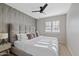 Beautiful bedroom with a ceiling fan, large window for natural light, and elegant decor at 16409 N 65Th Pl, Scottsdale, AZ 85254