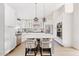 Bright kitchen with a center island, quartz countertops, stainless steel appliances, and pendant lighting at 16409 N 65Th Pl, Scottsdale, AZ 85254