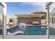 Inviting pool area with lounge chairs, a spa, and a cozy covered patio, perfect for relaxation at 16409 N 65Th Pl, Scottsdale, AZ 85254