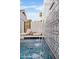 Relaxing backyard features a serene spa detail, complete with tile detailing and comfortable lounge chairs at 16409 N 65Th Pl, Scottsdale, AZ 85254