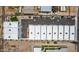 New townhome community featuring a parking lot, xeriscaping, and modern rooftop HVAC units at 1642 E Monte Vista Rd # 10, Phoenix, AZ 85006