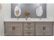 Contemporary bathroom boasts a double sink vanity, neutral walls, and decorative accents at 1642 E Monte Vista Rd # 10, Phoenix, AZ 85006