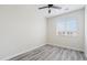 Light filled bedroom with light gray wood-look flooring and window at 1642 E Monte Vista Rd # 10, Phoenix, AZ 85006