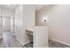 Bright hallway with a built-in desk space featuring neutral tones and modern lighting at 1642 E Monte Vista Rd # 10, Phoenix, AZ 85006