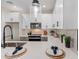 Bright, modern kitchen with sleek finishes, quartz counters and black hardware accents at 1642 E Monte Vista Rd # 10, Phoenix, AZ 85006