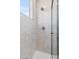 Modern shower with white subway tile, glass door, and rain shower head fixture at 1642 E Monte Vista Rd # 10, Phoenix, AZ 85006