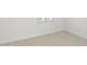 Bright, airy bedroom showcasing light-colored flooring and neutral walls at 17837 W Mission Ln, Waddell, AZ 85355