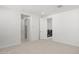 Hallway featuring an open door leading to the staircase with a black railing at 17837 W Mission Ln, Waddell, AZ 85355