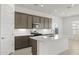 Modern kitchen featuring an island with white countertops and stainless steel appliances at 17837 W Mission Ln, Waddell, AZ 85355