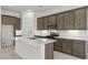 Well-equipped kitchen featuring an island with stainless steel appliances and ample cabinet space at 17837 W Mission Ln, Waddell, AZ 85355