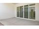 Wide patio area, perfect for outdoor entertaining, with sliding glass doors leading inside at 17837 W Mission Ln, Waddell, AZ 85355